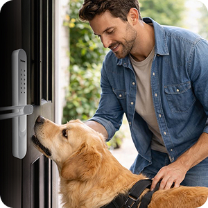 Person greeting a dog at the front door while using a smart lock keypad